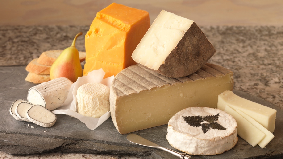 A cheese board with various cheeses that won't spike your blood sugar