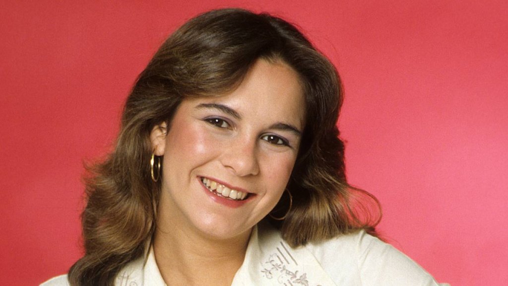 girl smiling; pretty in pink facts