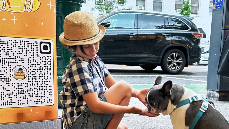 Julian giving a dog a treat