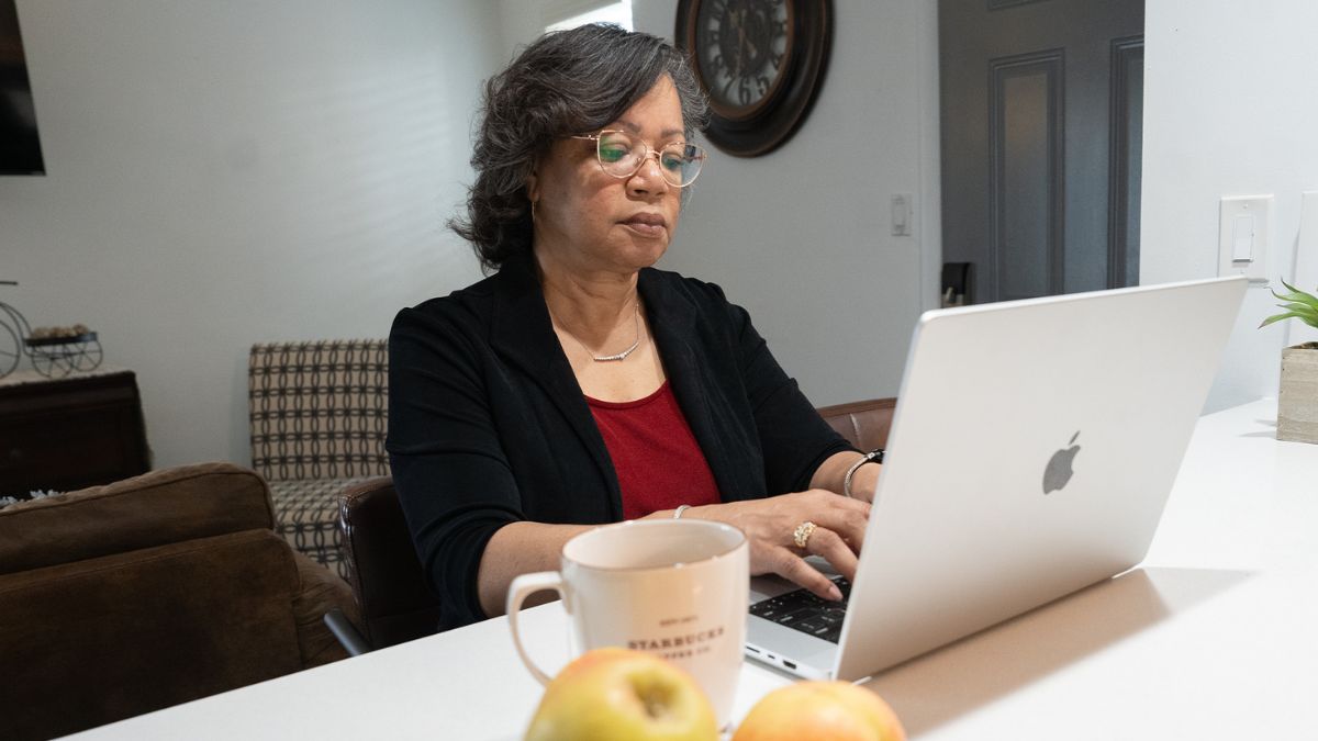 Lisa Roberts, who finally found the right depression treatment, sitting at her computer desk