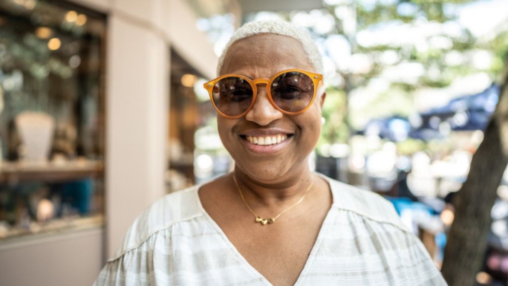 mature woman wearing sunglasses to treat thyroid eye disease