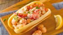 A traditional lobster roll as part of a guide on how to make smashed rolls