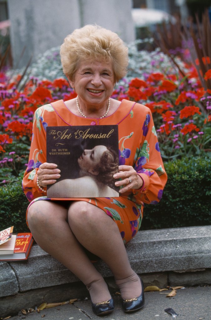 American sex therapist Ruth Westheimer showing her book 'The Art of Arousal', circa 1990