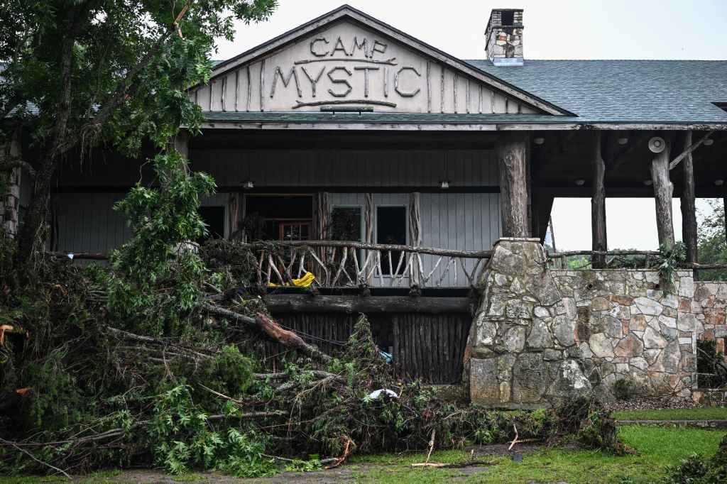 A view of Camp Mystic, the site of where at least 20 girls went missing after flash flooding in Hunt, Texas, on July 5, 2025. Rescuers were on Saturday searching for more than 20 girls missing from a riverside summer camp in the US state of Texas, after torrential rains caused devastating flooding that killed at least 27 people -- with more rain on the way. "So far, we've evacuated over 850 uninjured people, eight injured people and have recovered 27 deceased fatalities at this time. Of these 27, 18 are adults, nine are children," said Kerr Country Sheriff Larry Leitha on July 5. (Photo by RONALDO SCHEMIDT / AFP) (Photo by RONALDO SCHEMIDT/AFP via Getty Images)