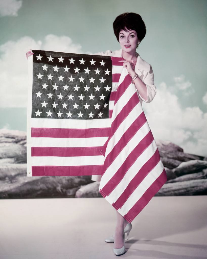 Joan Collins with American flag