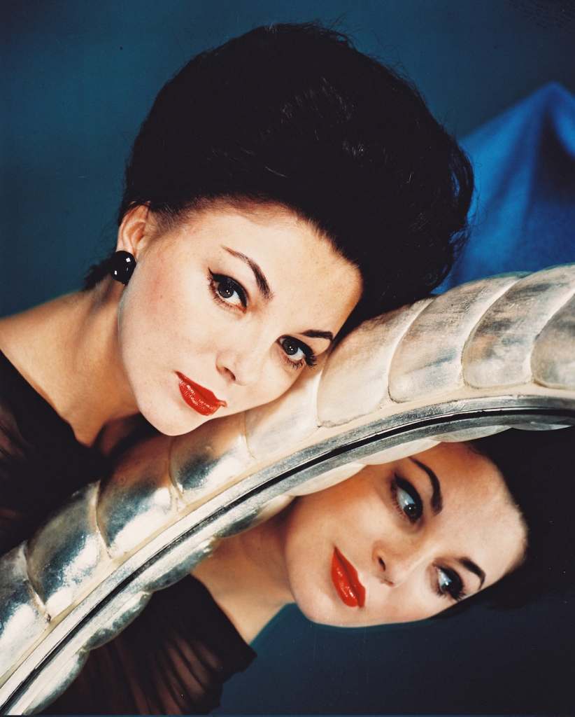Joan Collins with mirror in 1955
