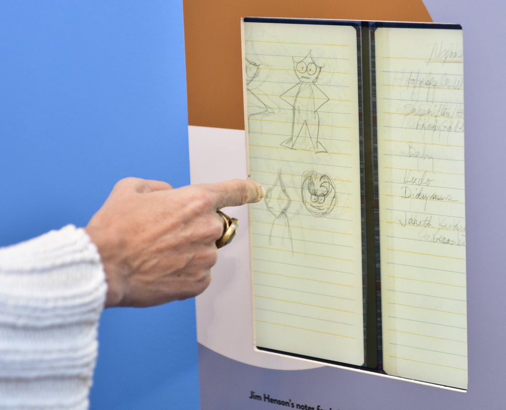 Attendee scrolls through Jim Henson's "The Labyrinth" notes at the press preview of The Jim Henson Exhibition: Imagination Unlimited at Skirball Cultural Center on May 30, 2018 in Los Angeles, California