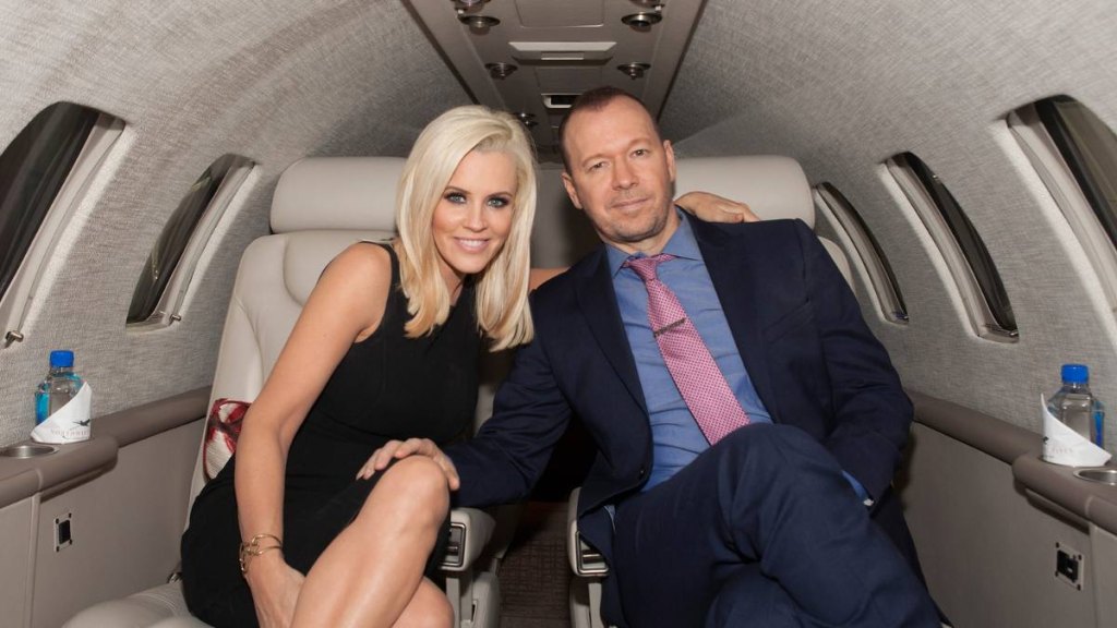 man and woman sitting in car; blue bloods couples