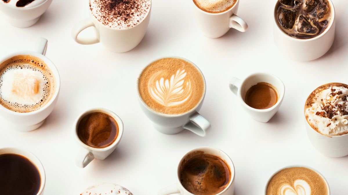 Various cups of different types of coffee, which may affect your vision, on a white background