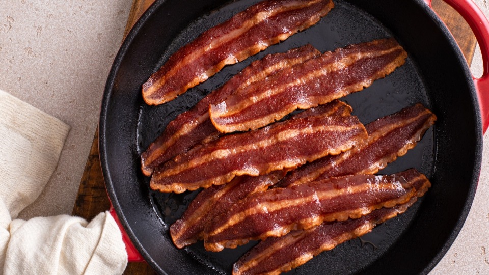 Turkey bacon in a cast iron pan