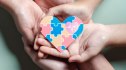 Father, Mother, Children holding heart jigsaw puzzle, Color puzzle symbol of awareness for autism spectrum disorder family support. Autism World Awareness Day.
