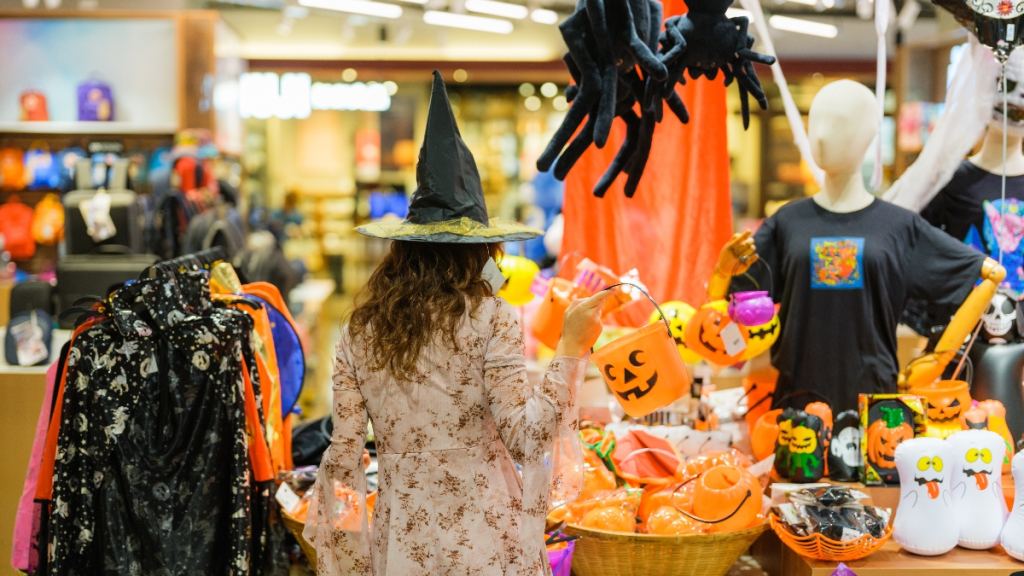 A woman shopping for Halloween decorations
