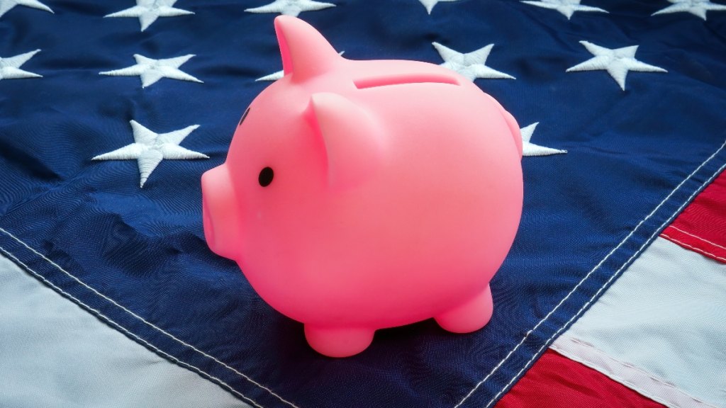 A piggy bank on an American flag