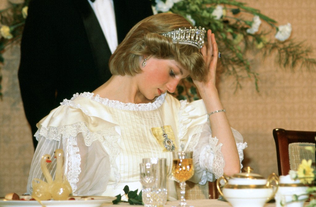 Princess Diana adjusts her tiara in 1983