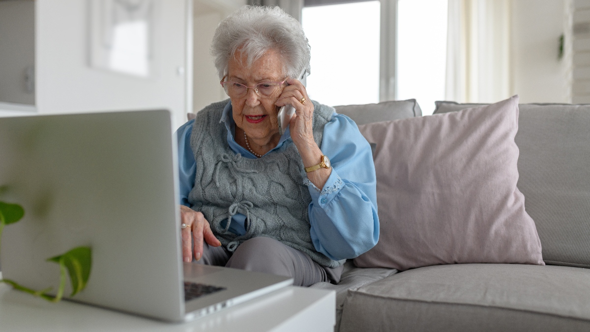 older woman on the phone and laptop