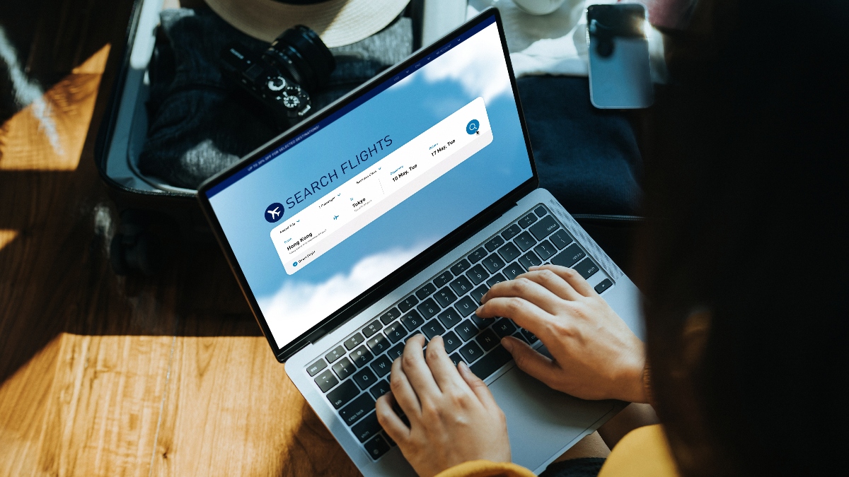 woman searching for flight online