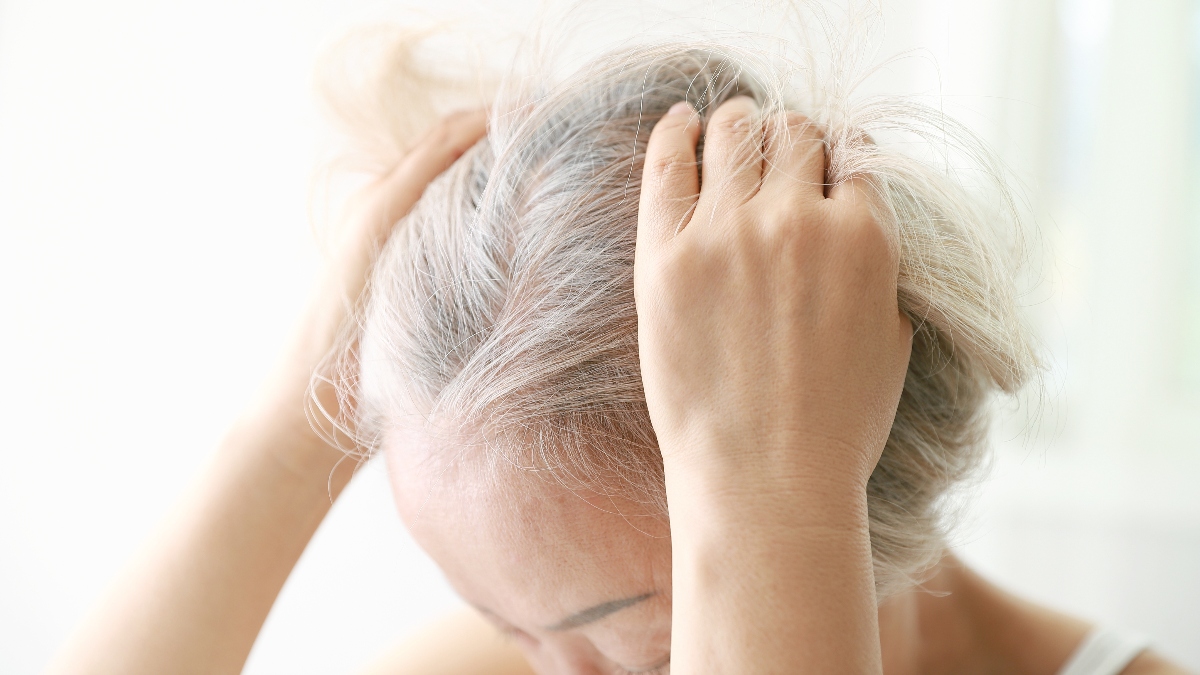 woman experiencing hair loss