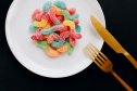 A plate of colorful protein gummy candy worms