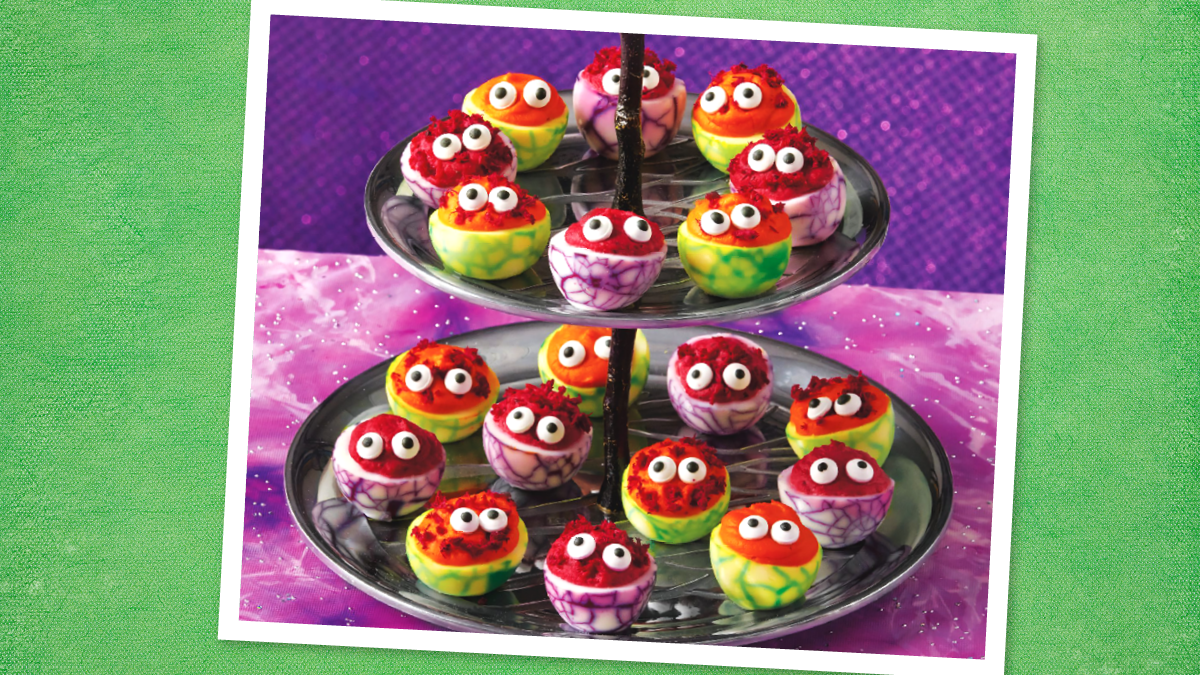 Devilish Eggs sit on a plate (halloween dinner ideas)