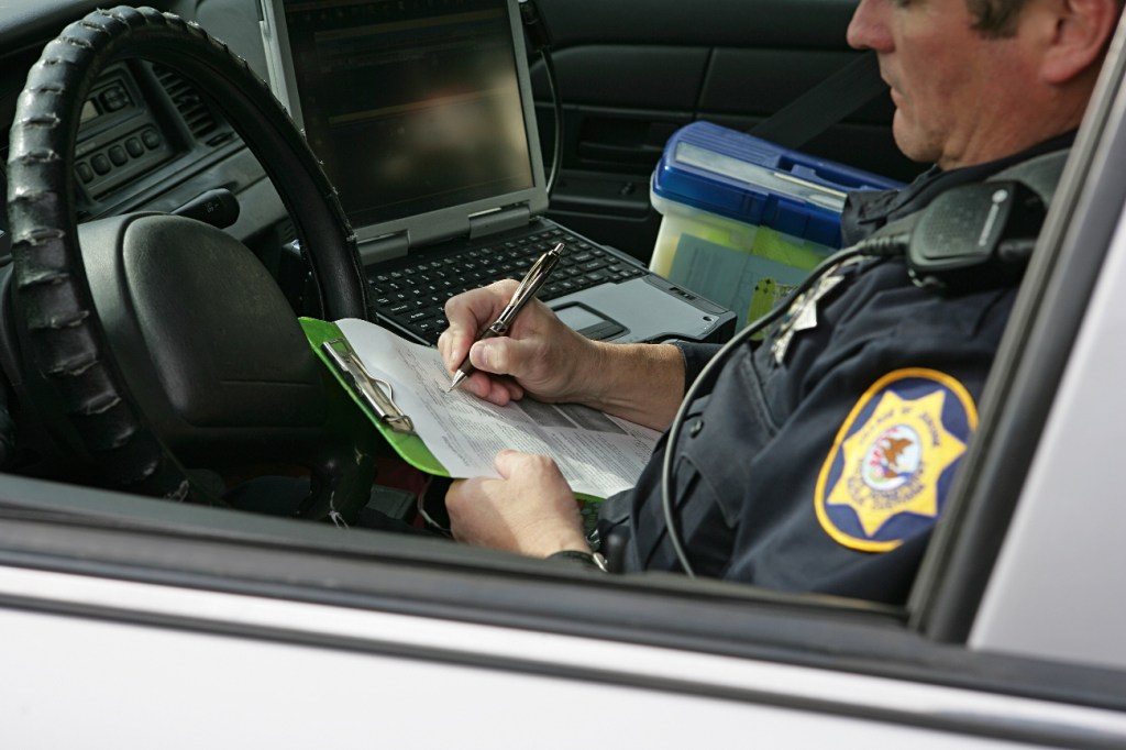 A police officer filling out paperwork