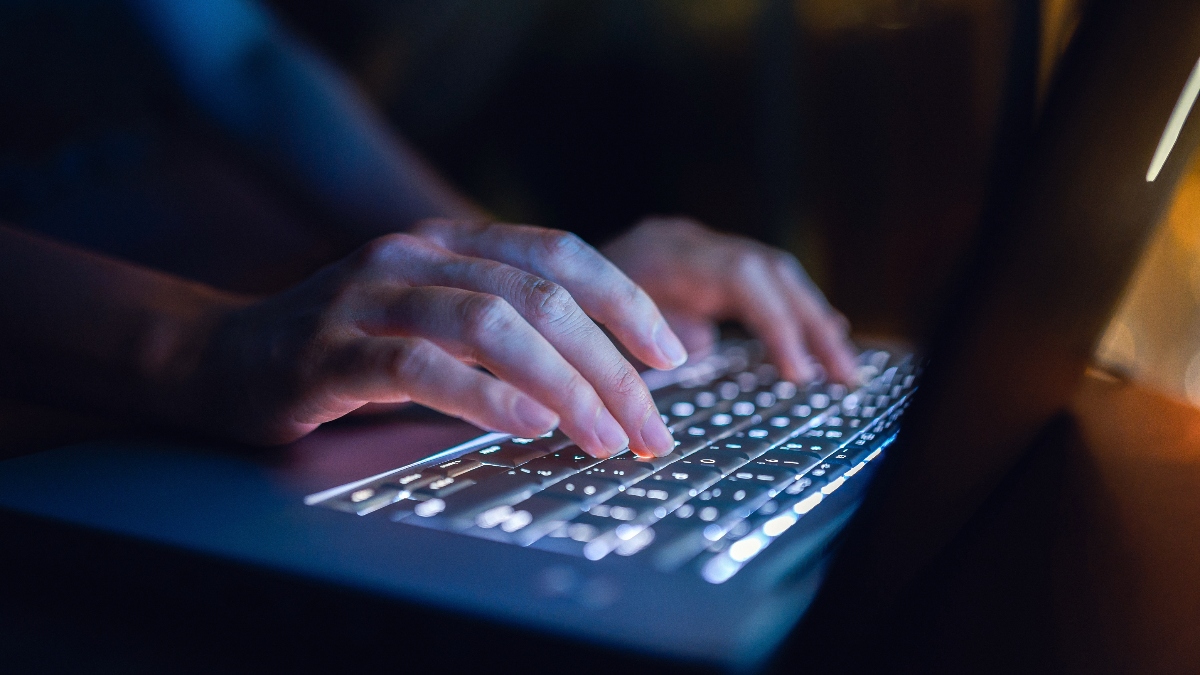 hacker typing on computer