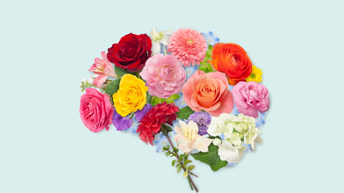 assorted flowers are artfully arranged to take the shape of the brain