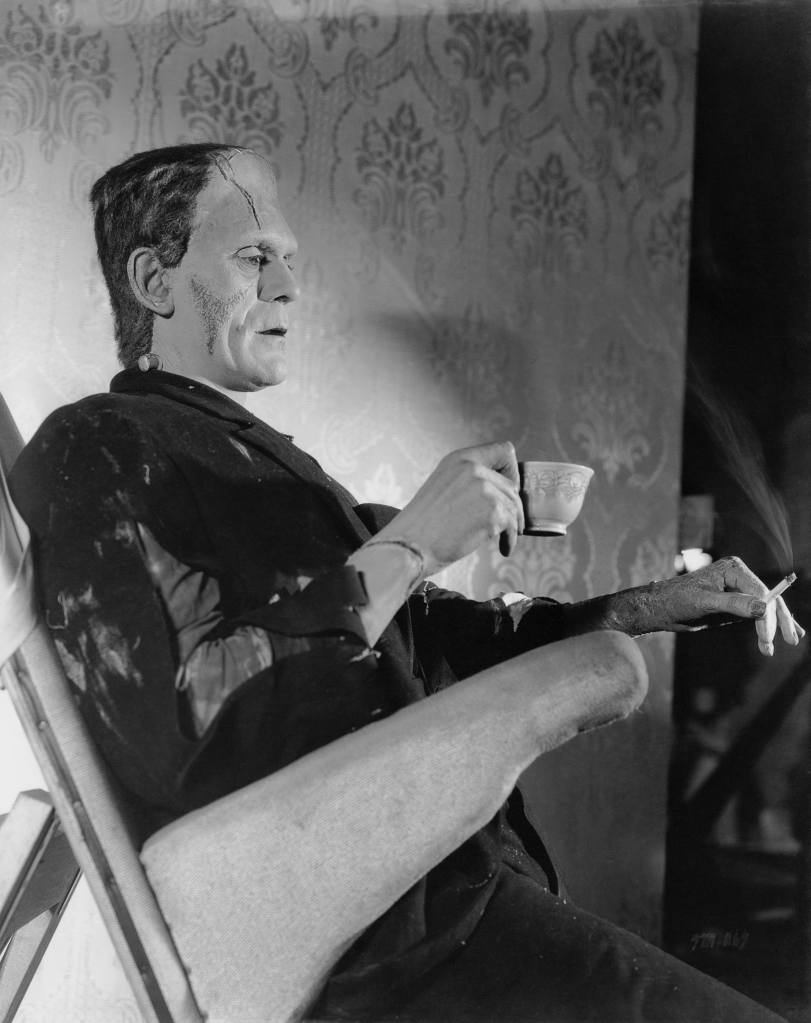 English actor Boris Karloff (1887 - 1969) relaxes on the set of the film 'Bride of Frankenstein', in which he reprises his role as Frankenstein's creation, 1935