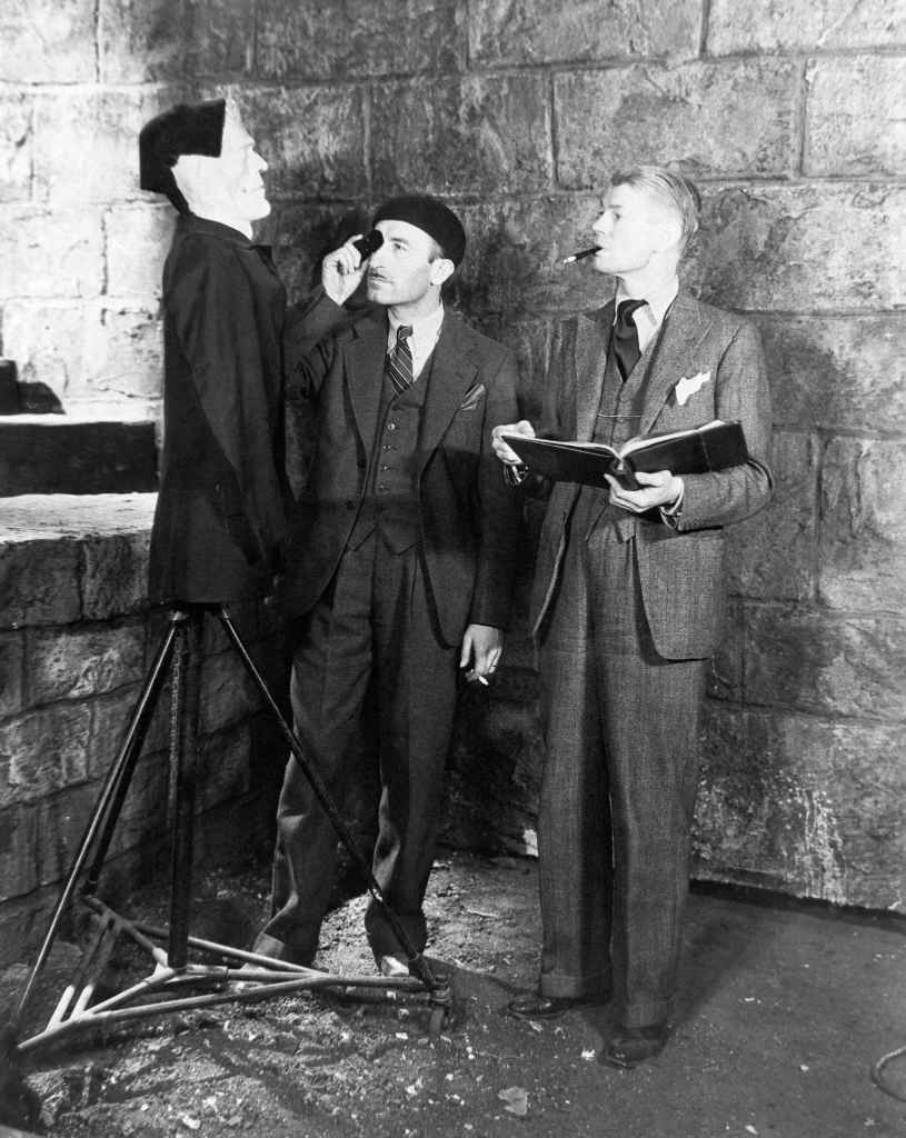 BRIDE OF FRANKENSTEIN, from left: cinematographer John J. Mescall, director James Whale having some fun on set, 1935