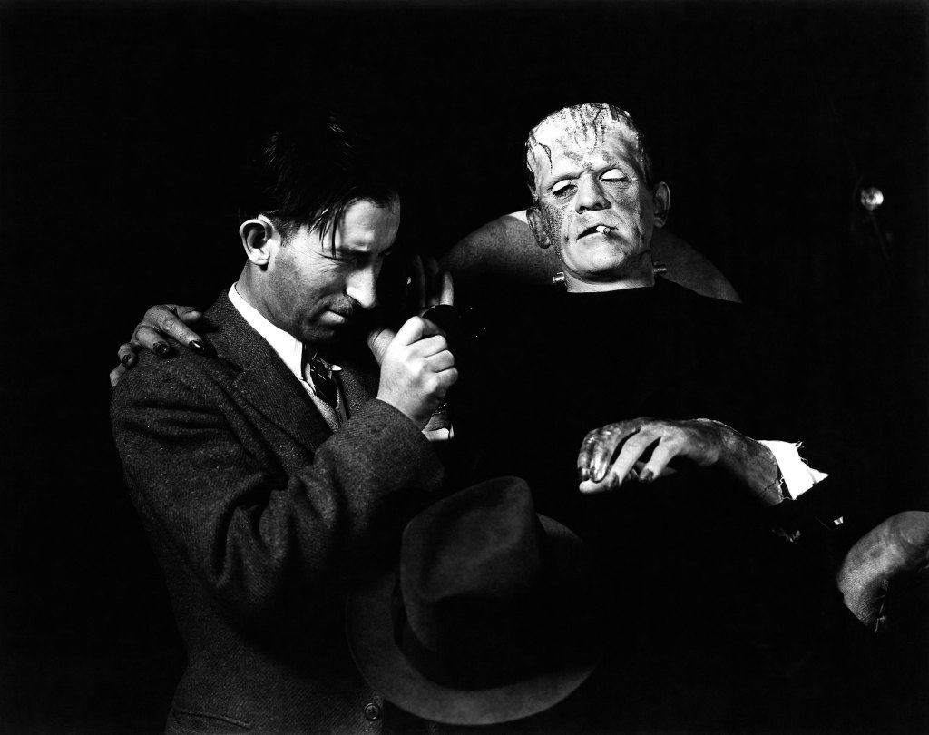 BRIDE OF FRANKENSTEIN, from left: cinematographer John J. Mescall, Boris Karloff, on set, 1935
