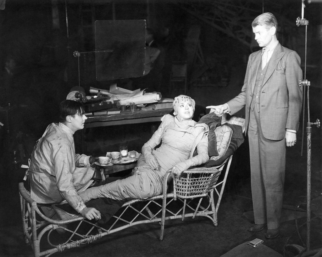 BRIDE OF FRANKENSTEIN, from left: Colin Clive, Elsa Lanchester, director James Whale on set, 1935