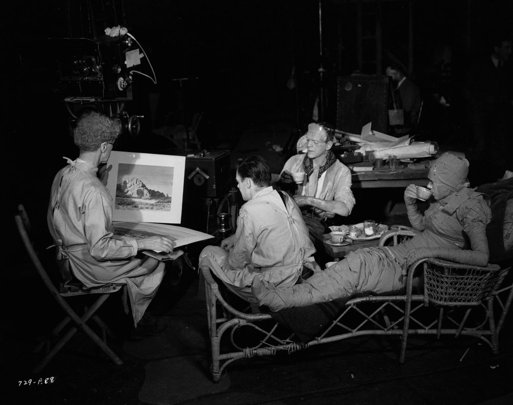 circa 1935: From left to right, actors Ernest Thesiger (1879 - 1961), Colin Clive (1898 - 1937), Boris Karloff (1887 - 1969) and Elsa Lanchester (1902 - 1986) examine some snowy landscapes on the set of 'Bride of Frankenstein', directed by James Whale