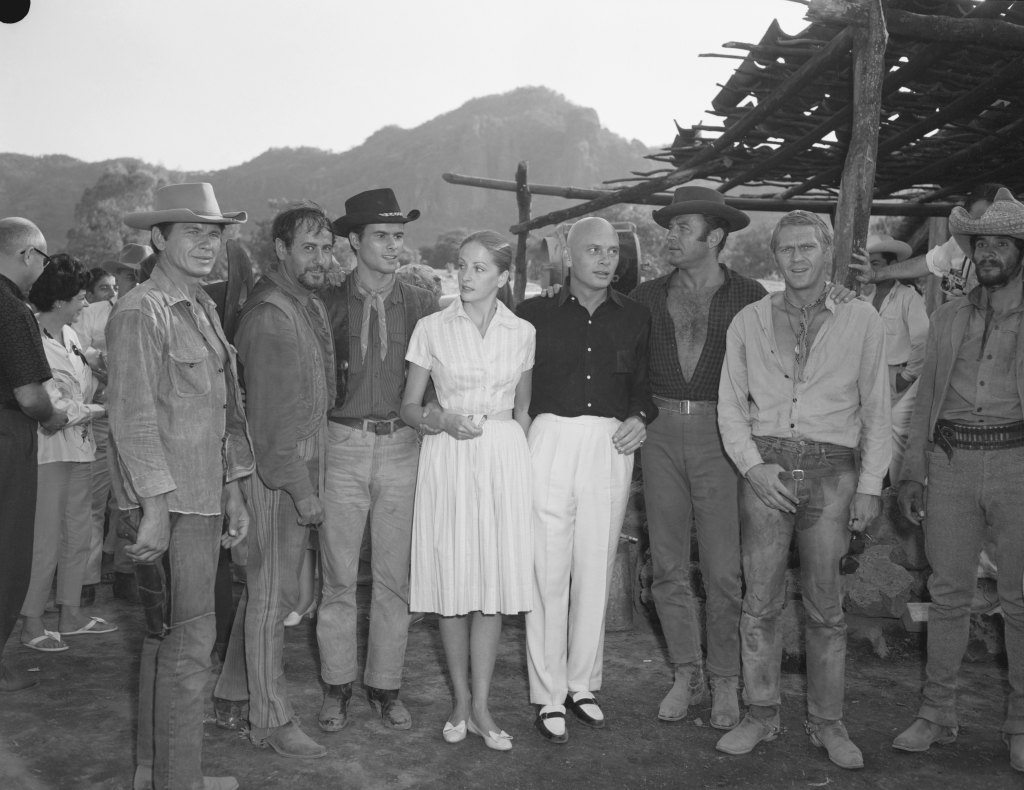 Yul Brynner with his recently married wife Doris, on the set of The Magnificent Seven. From left to right, are Charles Bronson, Eli Wallach, Horst Buchholz, Doris and Yul Brynner, Brad Dexter, and Steve McQueen.