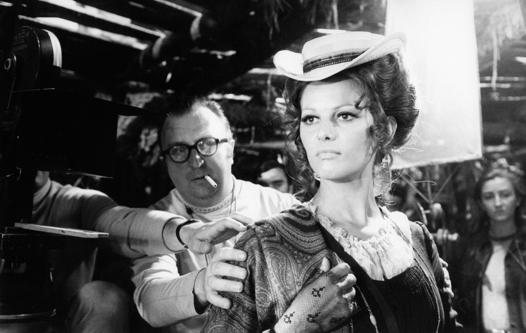 Italian actress Claudia Cardinale with director, screenwriter and producer Sergio Leone on the set of Once Upon a Time in the West