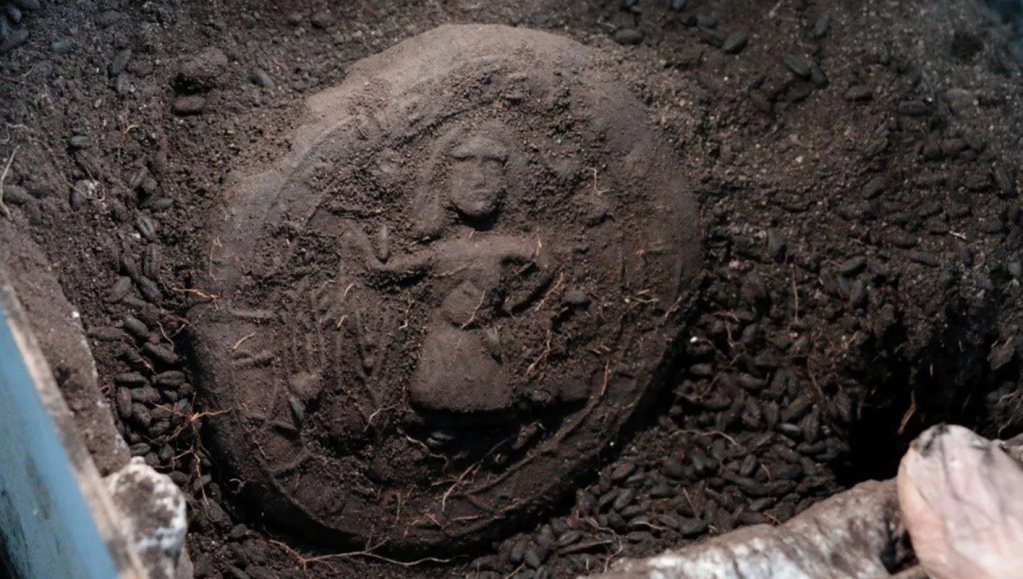 Loaf of ancient bread with Jesus imagery