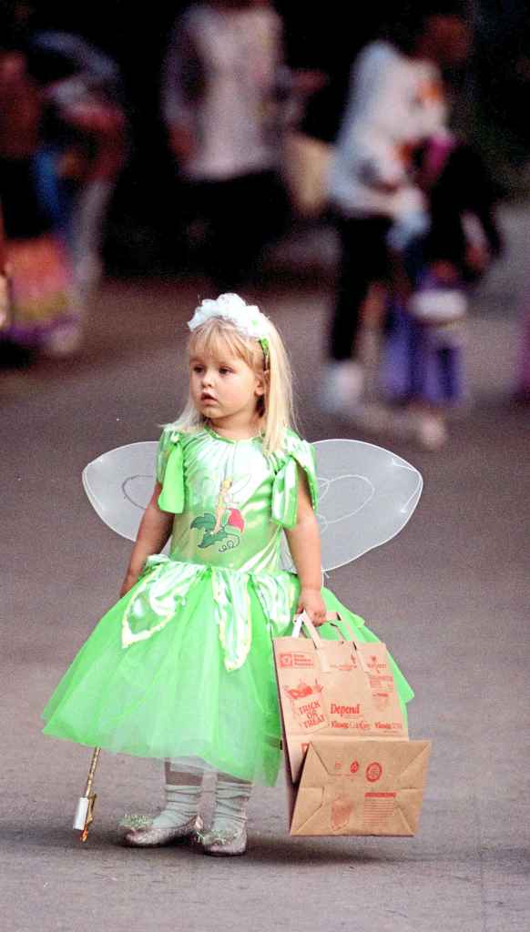 A trick-or-treater dressed as Tinker Bell in 1997