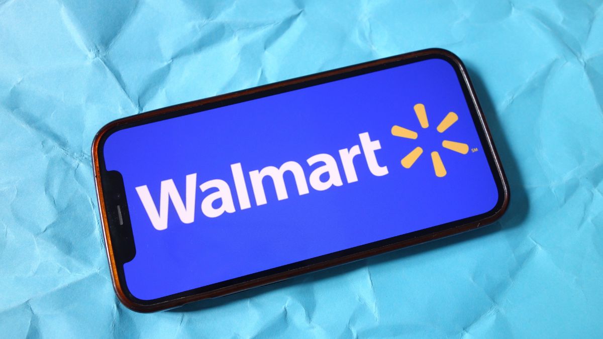 In this photo illustration, the Walmart company logo is seen displayed on a smartphone screen.