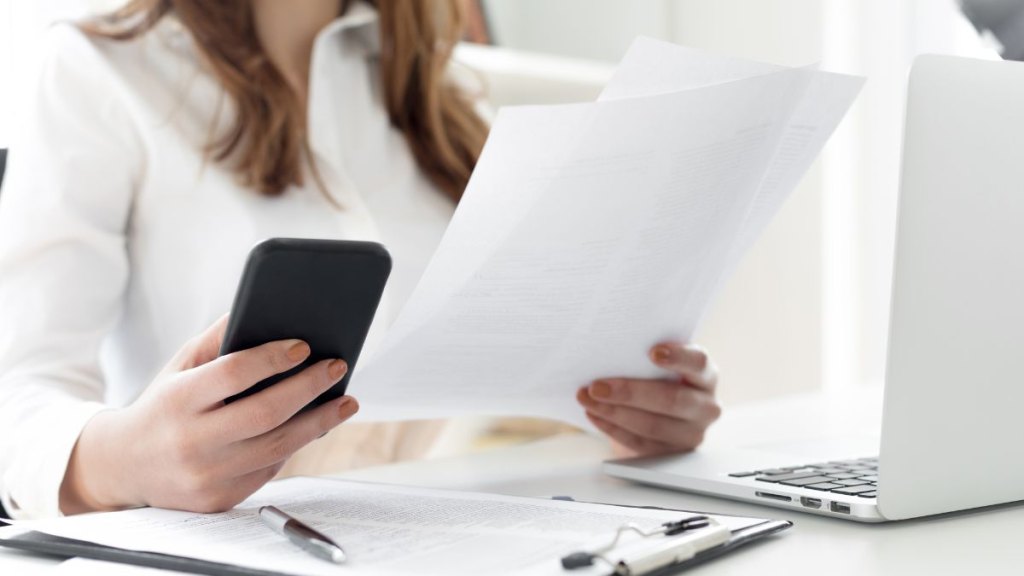 Businesswoman works with documents