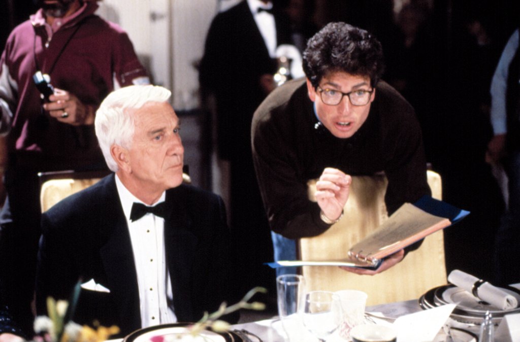 David Zucker directs Leslie Nielsen during the making of The Naked Gun 2 1/2: The Smell of Fear (1991)