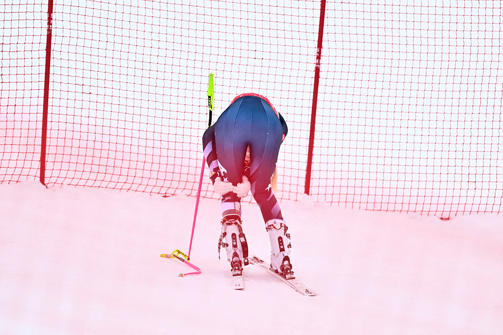 Lindsey Vonn holds her injured knee after crashing at the FIS Alpine Ski World Cup, 2026