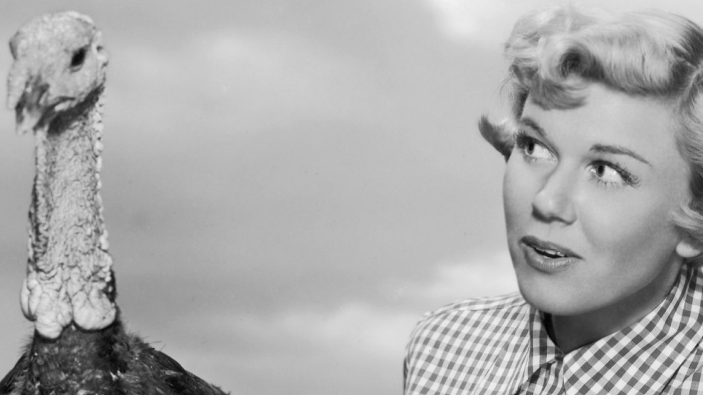 Doris Day poses with a turkey in 1955