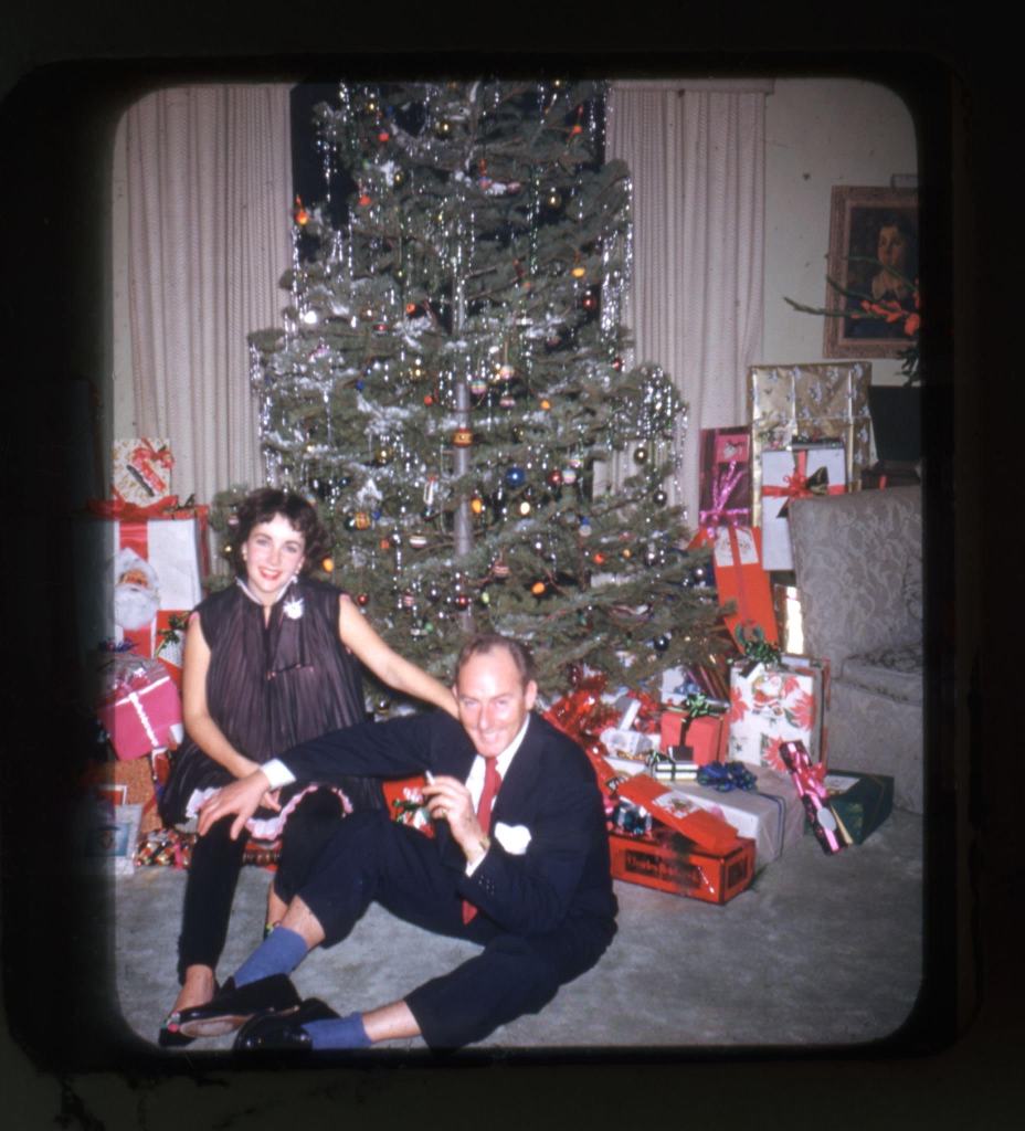 Elizabeth Taylor and her second husband, Michael Wilding, celebrate Christmas in 1952