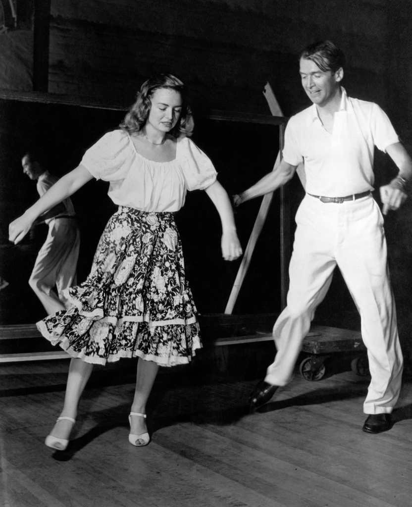 Donna Reed and James Stewart dancing on the set of It's a Wonderful Life