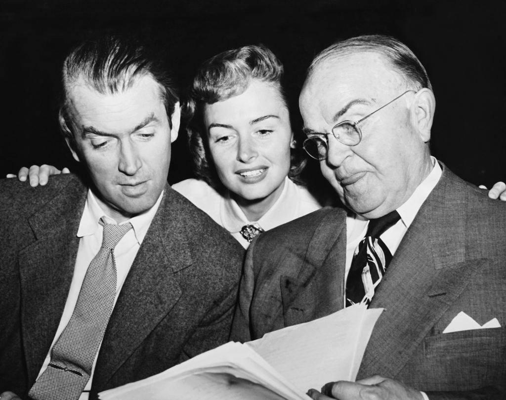James Stewart, Donna Reed and Victor Moore, looking at script for radio production of It's a Wonderful Life