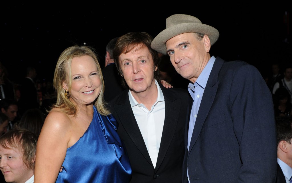 James Taylor and his wife, Caroline Smedvig, with Paul McCartney in 2012