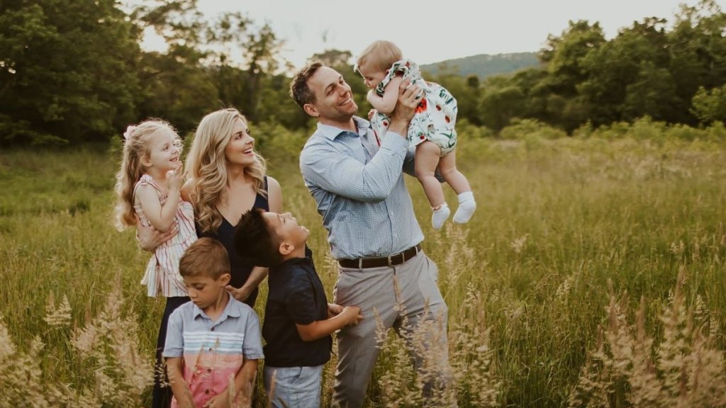 Jen Lilley and husband Jason Wayne pose with their adopted sons, Kayden and Jeffrey, and biological daughters, Julie and Jackie