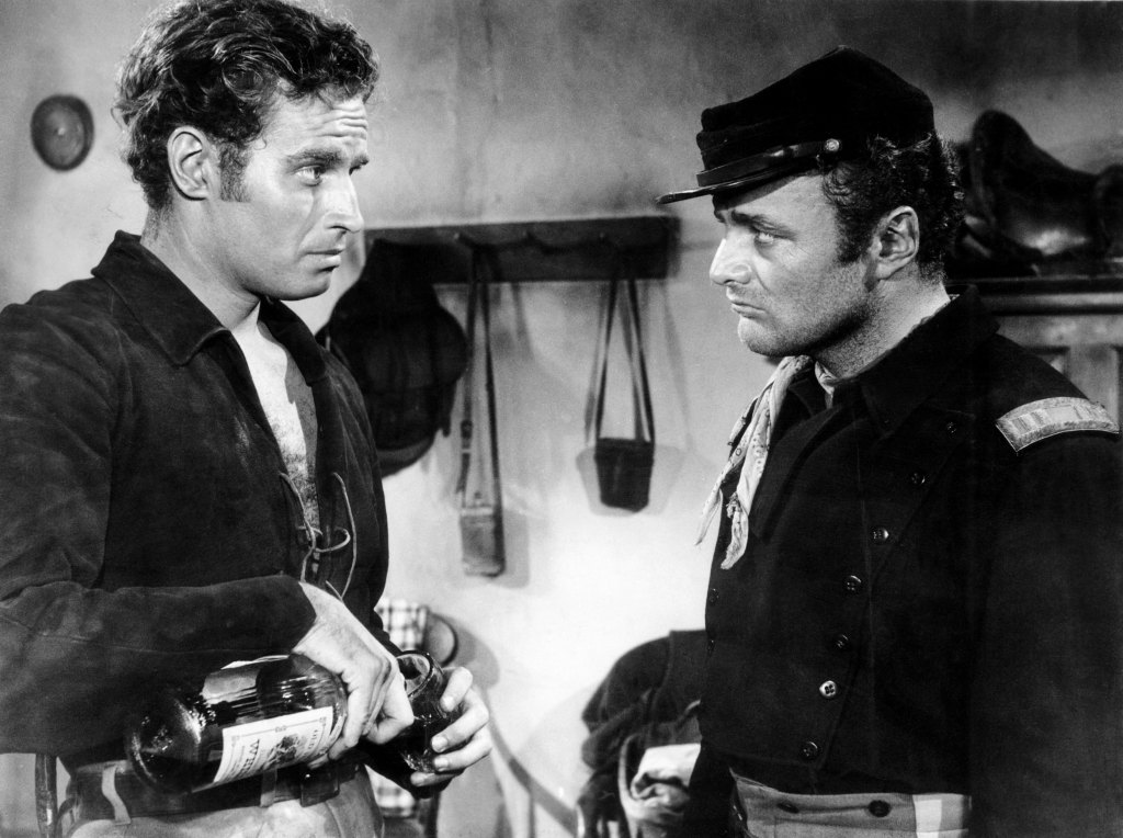ARROWHEAD, from left, Charlton Heston, Brian Keith, 1953
