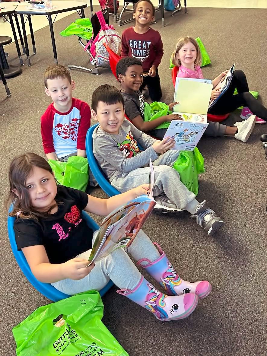 Students reading books from Bernie's Book Bank