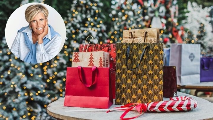 headshot of Suze Orman superimposed on a display of holiday shopping bags