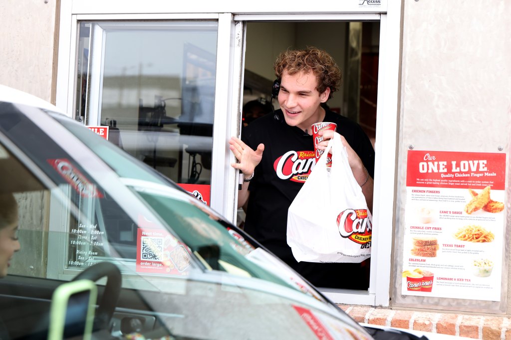 aiden ross serving fans at raising cane's