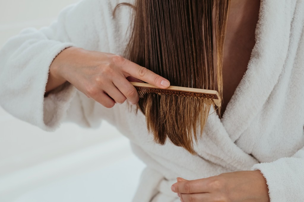 woman combing hair